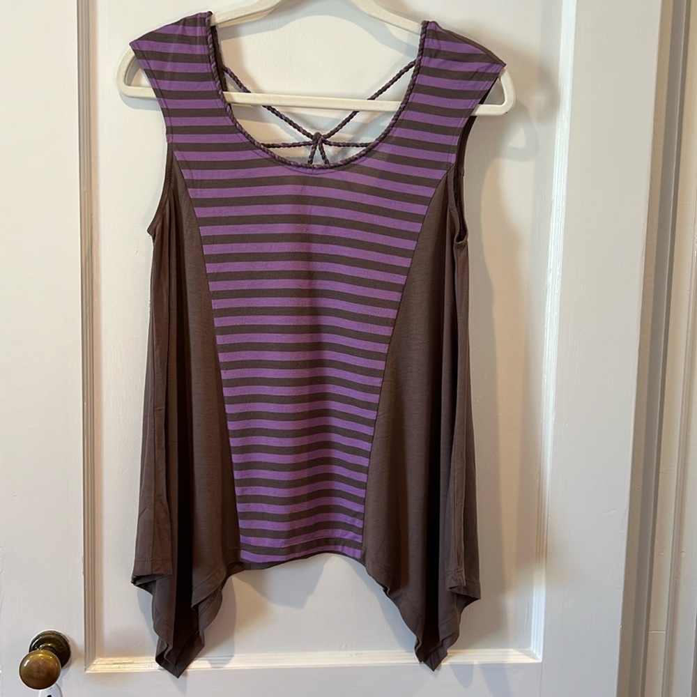 One September sleeveless top with twisted detail on back.